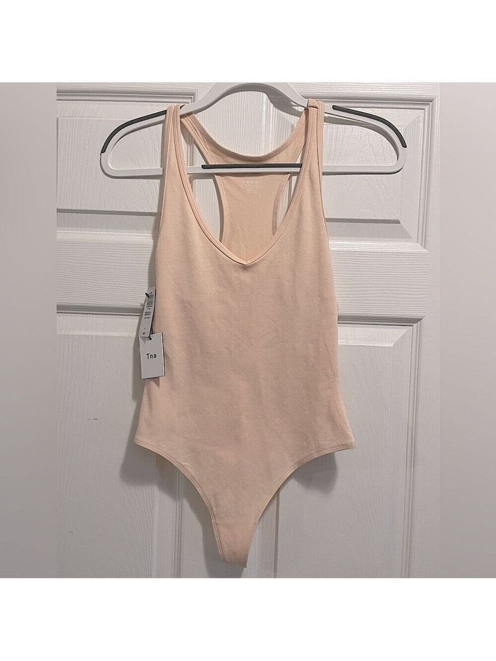 NWT TNA Rockfall Bodysuit Racerback Tank Pale Peach Size Small NEW